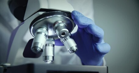 Wall Mural - microscope is meticulously focused on sample within wellequipped research laboratory environment