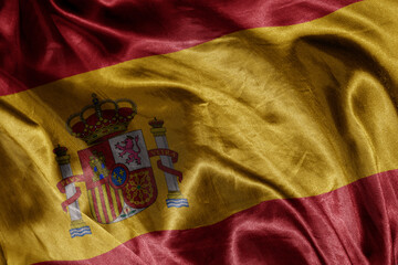 Wall Mural - shine waving colourful realistic national flag of spain . macro shot