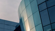 © Sofiia - facade of an office building with blue walls and mirrored windows