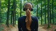 © Дмитрий Петров - Woman on forest path with headphones, listening peacefully