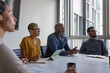 © ReeldealHD images - Successful mature businessman smiling in a business meeting at company growth