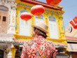 © YURII Seleznov - Young woman in ethnic dress and hat exploring the vibrant streets of Malacca, Malaysia. A blend of cultural heritage, colorful architecture, and tropical charm. Perfect travel and lifestyle moments.