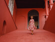 © YURII Seleznov - Young woman in ethnic dress and hat exploring the vibrant streets of Malacca, Malaysia. A blend of cultural heritage, colorful architecture, and tropical charm. Perfect travel and lifestyle moments.
