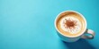 © BokehBox - Aromatic Cappuccino in a White Mug on a Vibrant Blue Background, Perfect for a Refreshing Morning