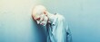 © TPS Studio - Health Warning Symptoms Concept. A digital image featuring a pale-faced, weak individual leaning against a wall, conveying feelings of vulnerability and introspection.