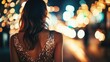 © redflower - Elegant woman in a glittering gown strolling through a city at night.