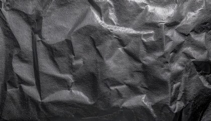 Poster - crumpled textured black fabric with reflective glossy surface, abstract geometric folds for background, texture design usage