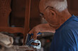 © carballo - upholsterer craftsman working in the workshop