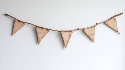 Wall Mural - Wooden triangular flags garland hung on a white wall with copy space for text or design elements