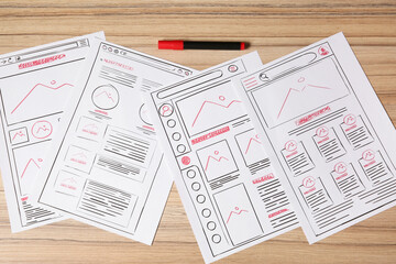 Wall Mural - website development. sketches of wireframes and felt pen on wooden table, flat lay
