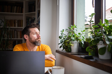 casual businessman working on a laptop