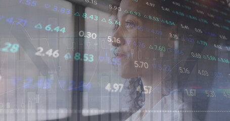Wall Mural - image of financial data processing over biracial businesswoman in office