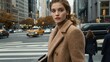 © Nuttaya Nampai - A stylish young woman crossing a busy crosswalk, wearing a professional outfit and carrying a portfolio, with office buildings in the distance.