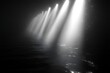 © armaya - Bright light beams over dark water.