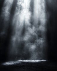 spotlight illuminating smoky, dark room.