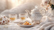 © Nadya - a luxurious Persian tea set with crystal glasses adorned with gold rims, a polished silver teapot, and a dish of saffron sugar cubes, arranged on a beautifully patterned tablecloth