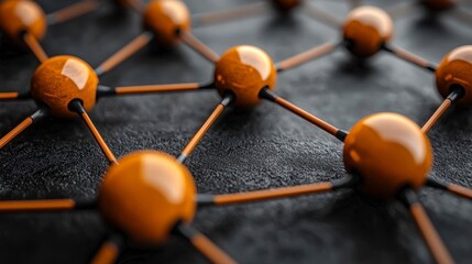 Wall Mural - Close-up of interconnected orange spheres on dark surface