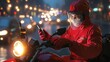 © santima - Delivery rider using smartphone in traffic at night.