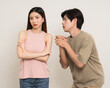© Chanakon - Bad relationship unhappy asian couple quarreling in various action gesture standing on isolated white background. Shouting angry man and woman stressed has problem in Married life