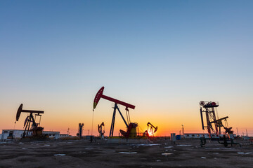 Wall Mural - In the evening, oil pumps are running, Silhouette of beam pumping unit