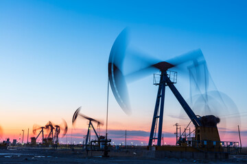 Wall Mural - In the evening, oil pumps are running, Silhouette of beam pumping unit