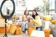 © freebird7977 - Startup small business.  Woman working with live cloths and product online computer at workplace. Freelance seller product order. Online selling and E-commerce. Shopping online
