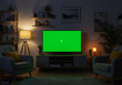 © Behram - A stylish and contemporary living room with a green screen television, providing a professional and polished backdrop for presentations or video calls