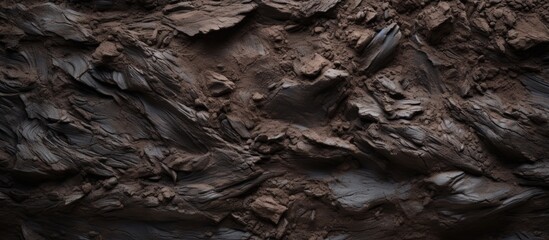 Leinwandbilder - Dark textured clay surface featuring rich browns and blacks with abstract elements creating depth and dimension, ample copy space on the right.