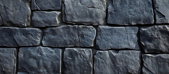 Poster - Dark gray rustic stone texture with rough tiles arranged in a captivating pattern ideal for backgrounds or banners in design projects