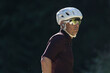 © Cavan Images - Cyclist in modern gear, focused and ready for outdoor adventure