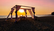 © SASITHORN - The sunset view scene with romantic dinner set up on the beach