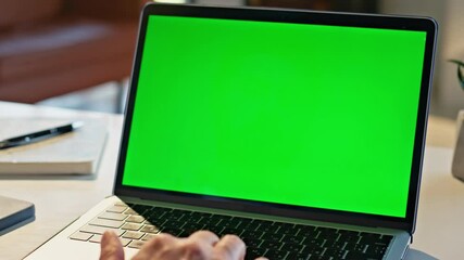 Wall Mural - Manager fingers scrolling chromakey laptop touchpad working at cozy home closeup