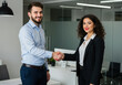 © OlehStock - Man shaking hands with girl