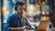 © Natalia Klenova - Focused man with headset working on laptop in cafe