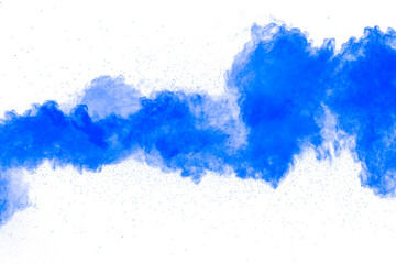 Wall Mural - Abstract blue powder explosion on white background. Closeup of blue dust particles splash isolated on clear background.