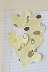 Wall Mural - random pile of hearts machine-cut from decorative scrapbooking paper featuring contemporary ovoid pattern on retro lined paper