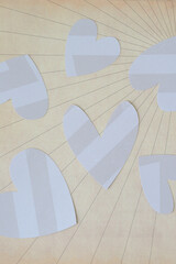 Wall Mural - several machine-cut hearts with stripes on decorative scrapbooking paper with radial illustration