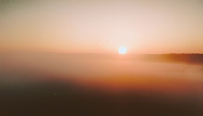 Wall Mural - vintage distressed abstract old photo of foggy sunrise, film grain, dust and scratches texture effec
