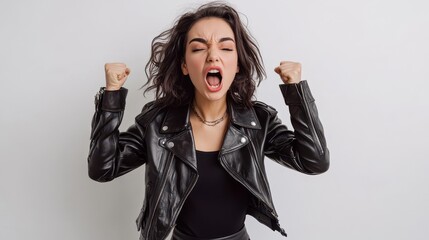 Wall Mural - A young woman wearing a leather jacket and a black skirt, confidently posing with a fierce expression on a white isolated background