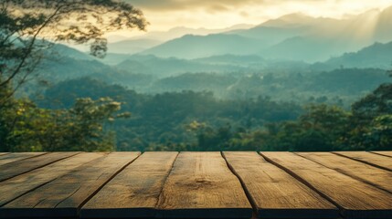 Poster - Serene wooden table overlooking a misty mountain landscape at sunset, ideal for nature-themed projects