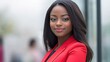 © QuietWord - close up black African woman face portrait, businesswoman at modern office building