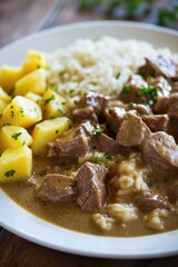 Wall Mural - A simple meal of rice and meat on a white plate