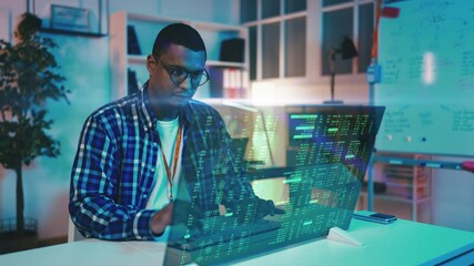 Focused IT developer writes programming code, working with futuristic technology