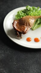 Poster - Duck leg confit baked bird meat fresh tasty food dish delicious gourmet food background on the table rustic food top view copy space