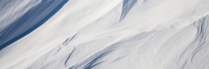 Wall Mural - snow texture. wind sculpted patterns on snow surface. wind in the tundra and in the mountains on the