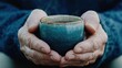 © Iona - Weathered hands gently cradle a steaming cup, evoking warmth, reflection, and the passage of time, subtly conveying life's enduring moments.