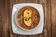 © mardoz - Onion soup with black background