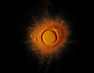 Wall Mural - Turmeric scattered powder pile isolated on black, top view	