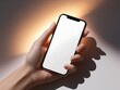 © dex - hand holding modern smartphone with a blank screen mockup, glowing softly under studio lighting