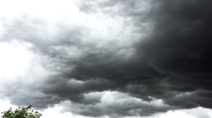 a moody, stormy sky filled with dark, swirling clouds, creating an intense and dramatic atmosphere a